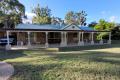 Charming 3-Bedroom Brick Home Amidst Nature on Acreage