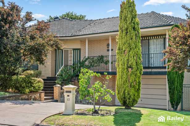 Split-level home with beautiful hillside views & sparkling swimming pool!