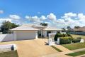 Executive four-bedroom residence, perfectly positioned near the ocean and pristine sandy beaches—an idyllic coastal retreat.