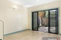 WELL PRESENTED 2 BEDROOM TOWNHOUSE WITH LOCK UP GARAGE, HEATING/COOLING & COURTYARD