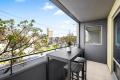 Modern Two-Bedroom Apartment with Loft, Study Nook & Entertainer's Balcony.