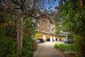 QUIETLY NESTLED IN LEAFY, PRIZED SURROUNDS