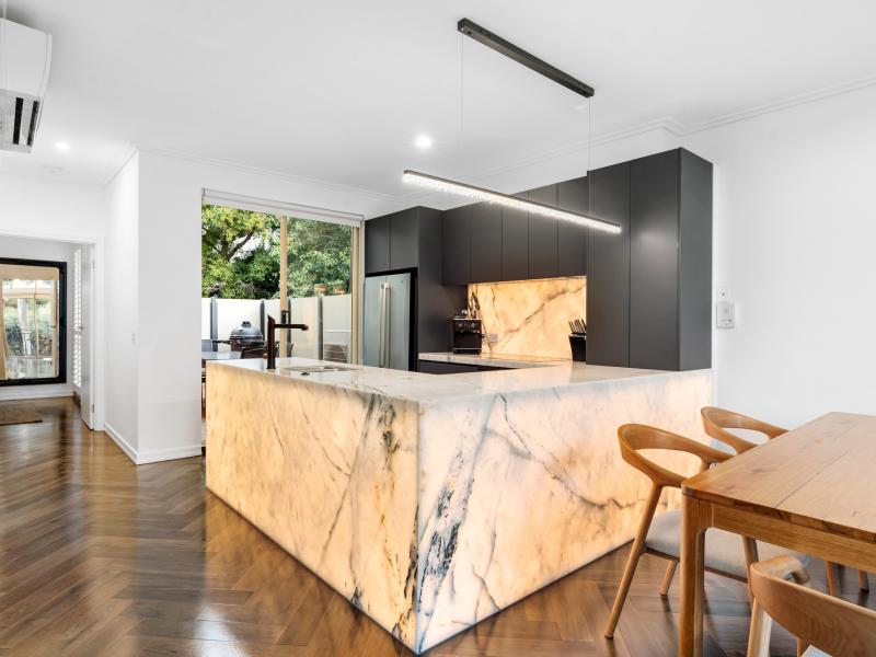 Designer Renovation with Soaring Ceilings and Iconic Arched Window