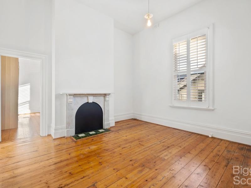 Victorian charmer in an old mansion in St Kilda’s best treelined location.