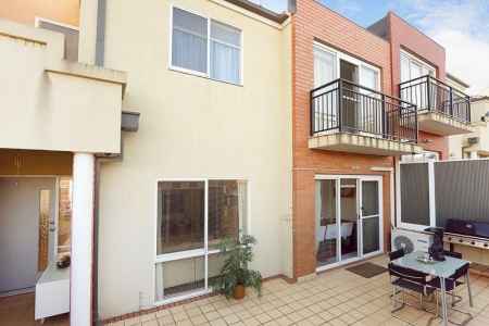 This smartly designed tri-level town home will most certainly delight!