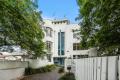 DECO WITH 2 BEDS, BALCONY, COURTYARD & PARKING IN ELWOOD'S BEST LOCATION!