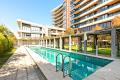 LUXURY EXECUTIVE ONE BEDROOM APARTMENT WITH STORAGE CAGE, BALCONY WITH VIEWS, CAR PARK & AIRCONDITIONING