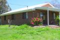 COMFORTABLE BRICK HOME IN TRANQUIL SETTING.
