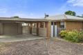 Brick veneer home with shedding