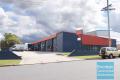 FREESTANDING BUILDING WITH 6 STRATA INDUSTRIAL UNITS