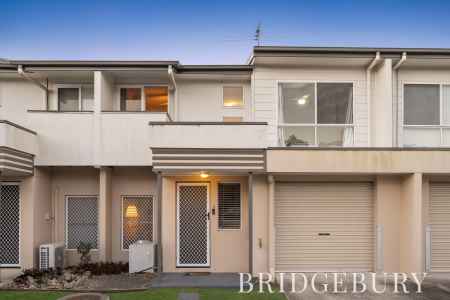 Spacious Three-Bedroom Townhouse with Pool & Low-Maintenance Living