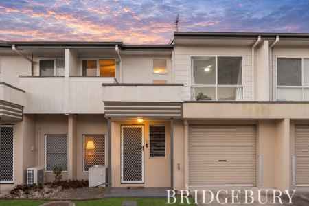 Spacious Three-Bedroom Townhouse with Pool & Low-Maintenance Living
