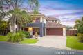 Large Elegant Family Retreat on a 785m² Block with Multiple Living Areas, Pool, and Room for a Caravan or Boat