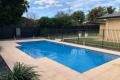 IMMACULATE FAMILY HOME WITH IN-GROUND POOL