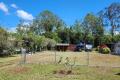 Large 1/4 acre block fully fenced with power & water, tiny house, double carport & container for only $149,000