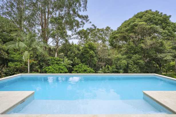 TROPICAL SETTING LOOKING OUT OVER THE NEW POOL