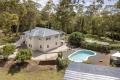 CHARACTER FILLED FAMILY HOME ON LEVEL ACREAGE.