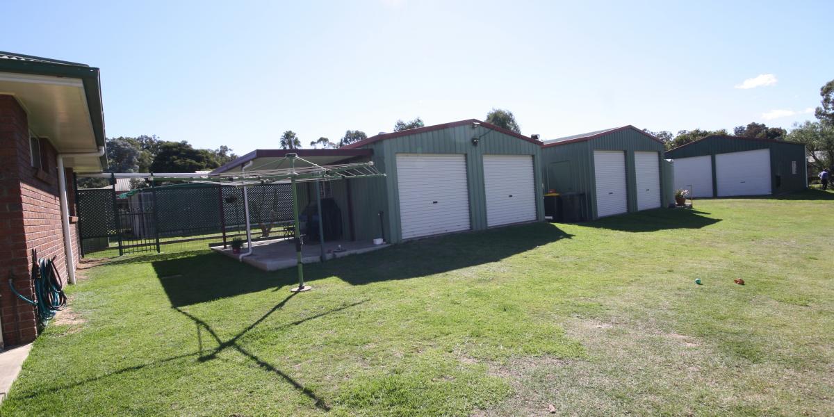 Appealing & Immaculate Brick Home With Sheds