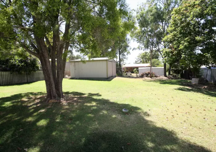 back of house looking to garage and back fence