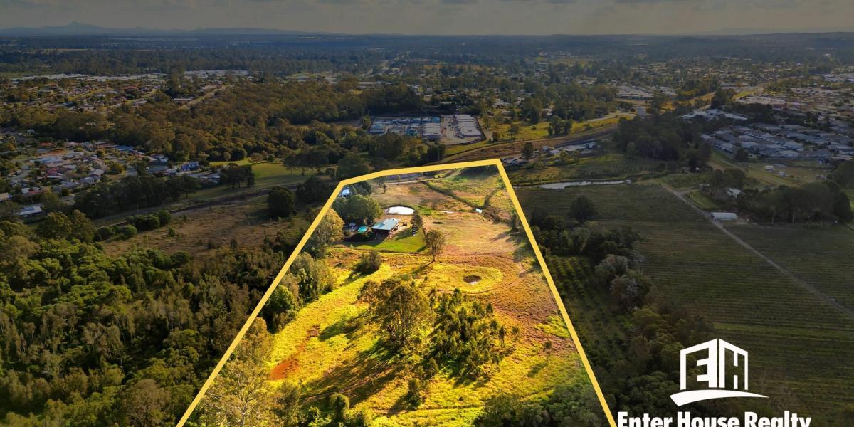 HIDDEN GEM COUNTRY LIVING SO CLOSE TO TOWN – STUNNING ELEVATED TIMBER POLE HOME ON 12.6 ACRES WITH RIVERFRONT, POOL & SHED!