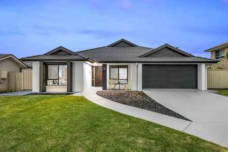 Stylish family home with shed, side access & security - welcome home to 3 Cullagh Street in Central Lakes!