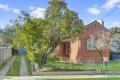 Classic red brick home in excellent blue chip locale!