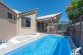 Air-Conditioned 4 Bedroom Home! Inground Pool! Close To School & Shops!