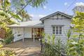 Classic Queenslander Charm with Lush Gardens in a Central Location