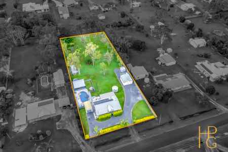 Acreage Lifestyle with Saltwater Pool, Powered Sheds & Space for All the Toys on 4,000m²