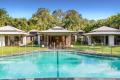 RESORT-STYLE ACREAGE IN PRESTIGIOUS DOONAN LOCATION