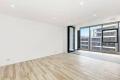 A newly constructed, one-bedroom apartment with a parking space is available for rent, located near the Woolworths mascot.