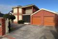 "Impressive 4-Bedroom Family Home with Theatre Room & Outdoor Entertaining"