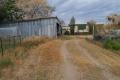 Double Block with three bedroom house and machinery shed!