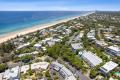 Contemporary Retreat with High-End Finishes & Peaceful Outlook in the Heart of Sunshine Beach Village, Minutes to the Beach. 