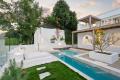 Sculptured Modernist Lair Steals Lakefront Limelight 