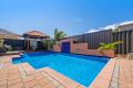 Summer-ready family sanctuary with pool & powered shed