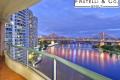 Luxurious Riverside Living with Iconic Story Bridge Views