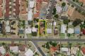 A little beauty: lovely weatherboard house on a big Triplex.