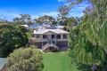 Embrace Coastal Elegance: Distinguished Queenslander with Breathtaking Ocean Views