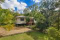 PRIVATE ACREAGE OASIS WITH TWO QUALITY HOMES, MINUTES TO COOLUM BEACH
