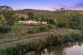 Rare Riverfront Property with Endless Potential