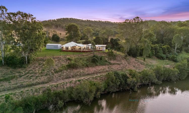 Rare Riverfront Property with Endless Potential