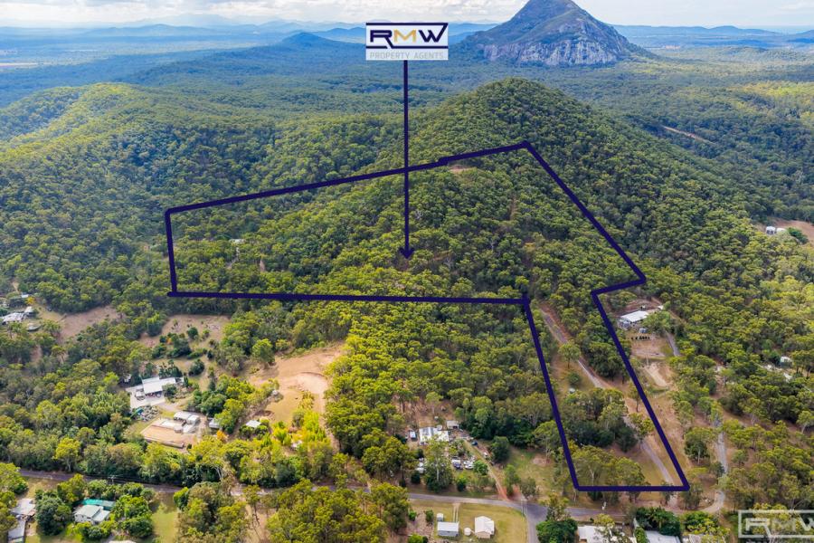 Spacious Acreage Living with Privacy and Potential for Dual Living.