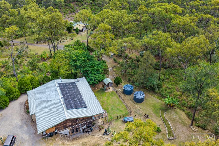 Spacious Acreage Living with Privacy and Potential for Dual Living.