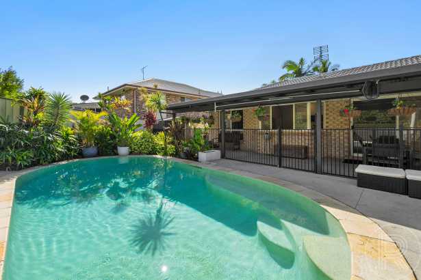 Family Home with Pool and Storage Galore !