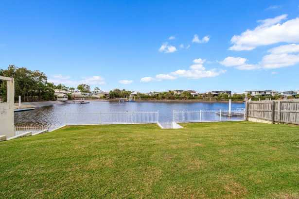 Deepwater canal-front home offering laid back living with development potential
