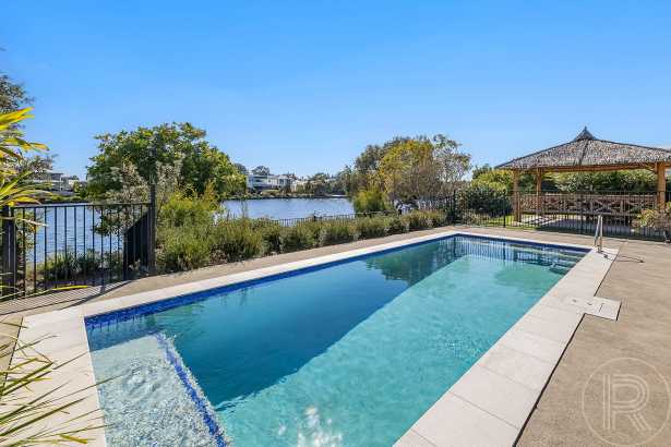Stylish Single-Level Waterfront Living on 700m² with Pool