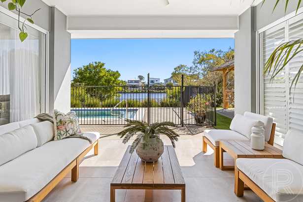 Stylish Single-Level Waterfront Living on 700m² with Pool