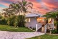 A Queenslander Masterpiece with Dual Living, Designer Finishes & Heated Pool