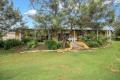 A unique & beautiful 4 bedroom family home with loads of extras in a semi-rural location on a large block